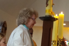 Clem preparing the Eucharist